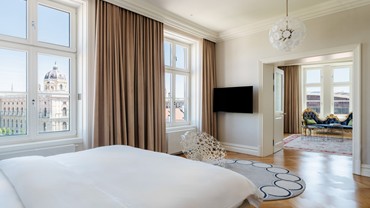 Master Suite with spacious bedroom, high windows and panoramic city view.